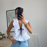 White Ruffle Blouse With Black Ribbon Tie