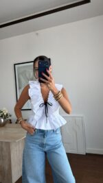 White Ruffle Blouse With Black Ribbon Tie