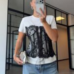 Black Lace Corset Over White T-Shirt